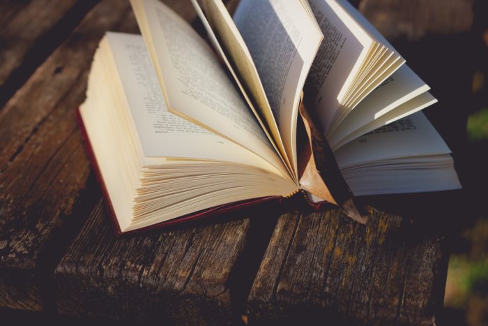 open book on a wooden table